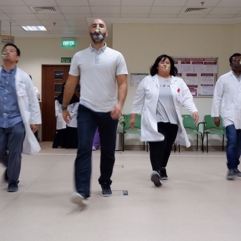 Photograph showing a celebration held in Qatar to mark World PT Day 2019