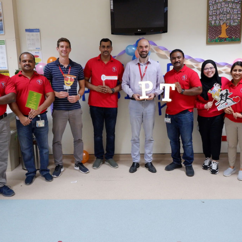 Photograph showing a celebration held in Qatar to mark World PT Day 2019