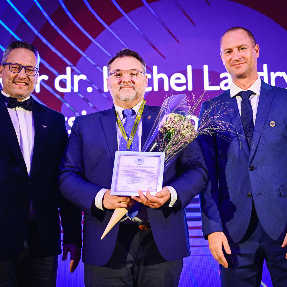 Mike Landry with leaders of Slovenian association