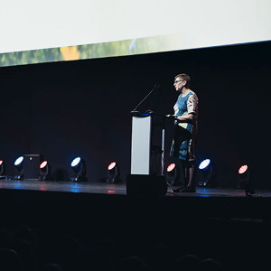 Anne Moseley giving a speech on stage